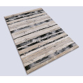 Microfiber tufted carpet with abstract design